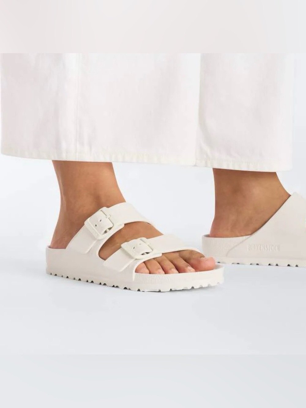 Birkenstock Arizona Essentials slide sandals in white, lightweight EVA